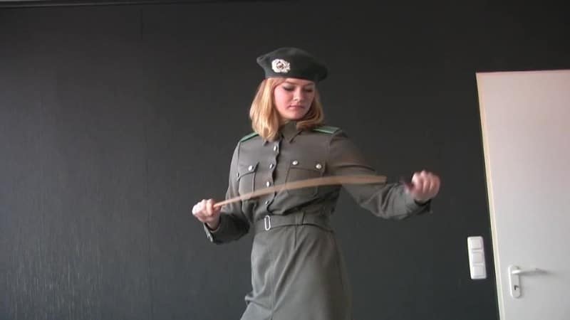 FemdomFoto - Laetitia - Preparing Whip Officer (German) 1