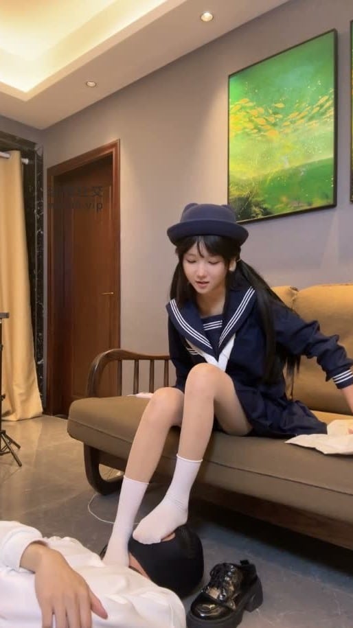 A Cute Girl In A Japanese School Uniform Tramples On Her Sex Slave's Face And Body. 5